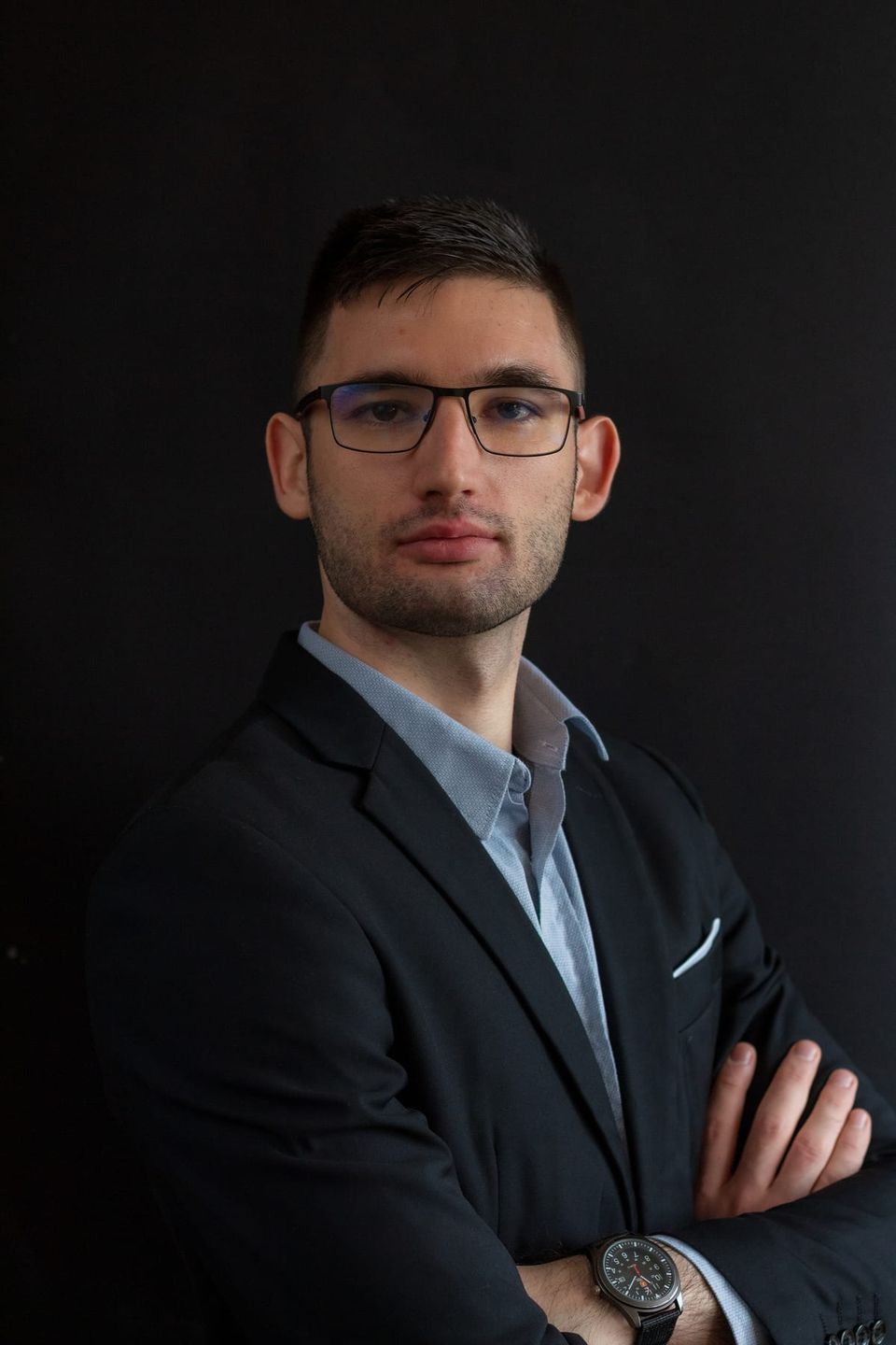 Portrait of Teo Parashkevov in a dark blazer with arms crossed